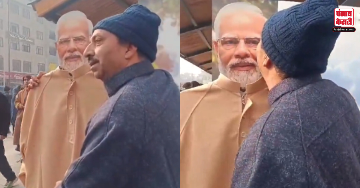 Kashmiri Man Kisses PM Modi Cutout
