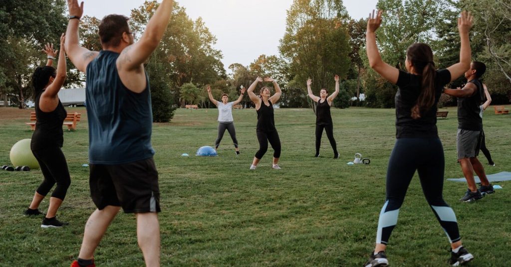 group outside doing moderate exercise 1200x628 facebook 1200x628 1