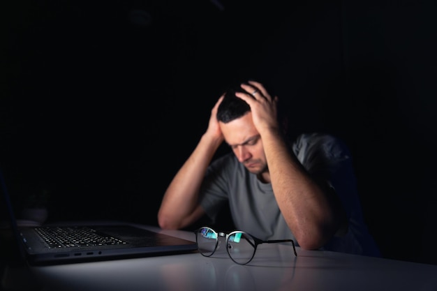 1365813 young man works computer night169016 59488