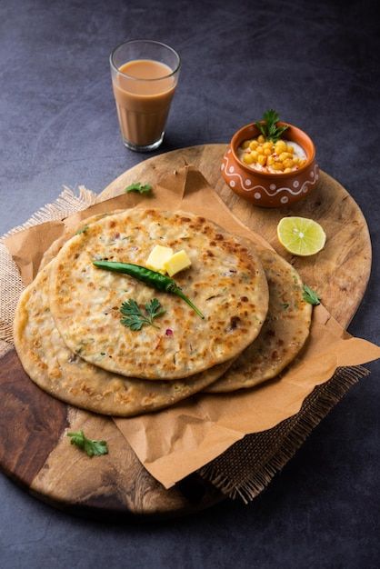 1380899 Premium Photo Paneer paratha is a popular North Indian flatbread made with whole wheat flour dough and stuffed with savory spiced grated paneer 1