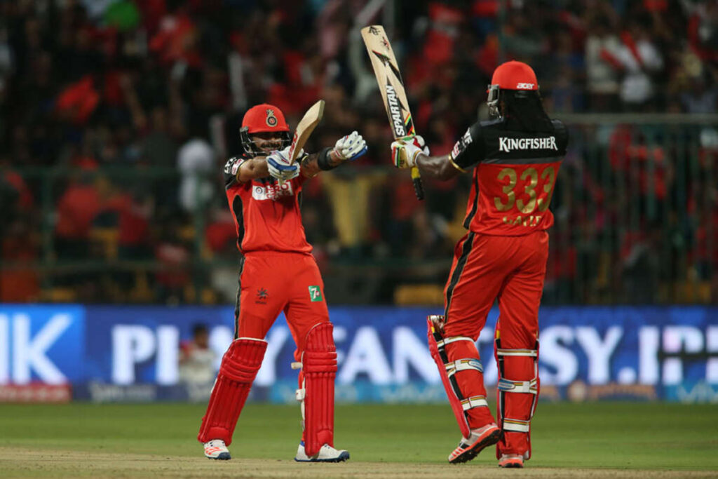 1391530 Virat Kohli with Chris Gayle f